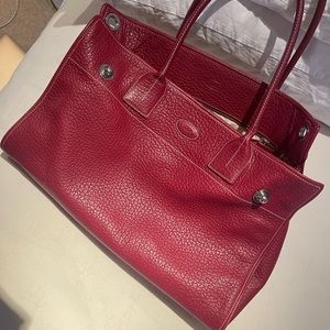 Tod’s shoulder bag in dark red with silver hardware.